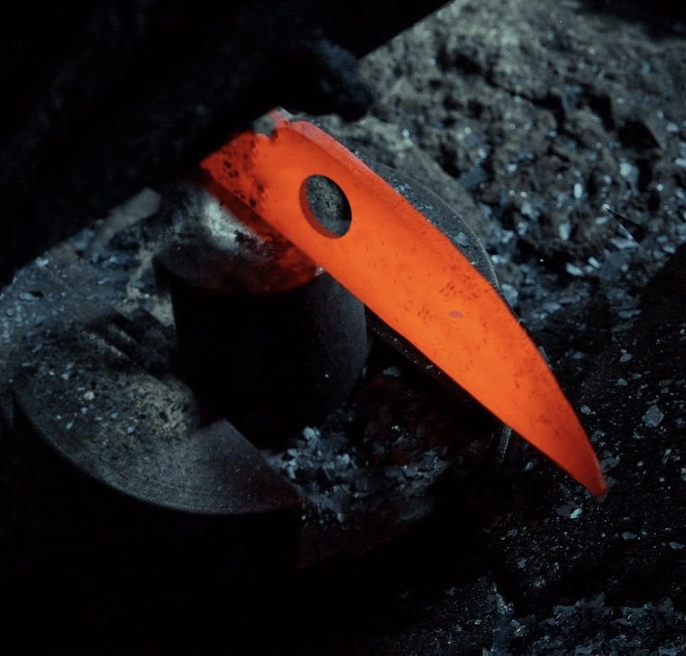 Glowing hot knife blade during the forging process